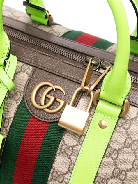 gucci rolling duffle bag.